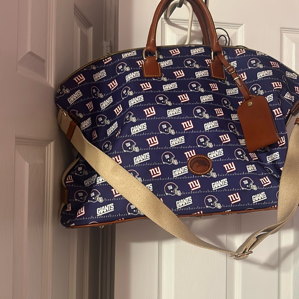 Never used Dooney and Burke Giants weekender bag with tags